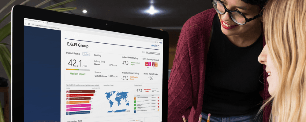Two women analyze a business dashboard on a laptop, showing project ratings and SEO rankings.